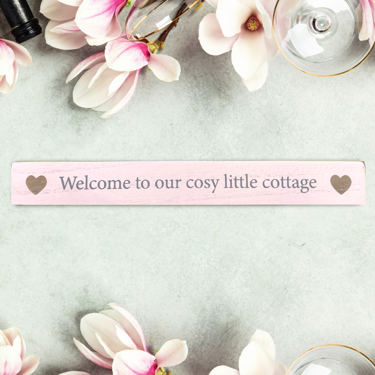Front image showing cosy cottage pink plaque with hearts
