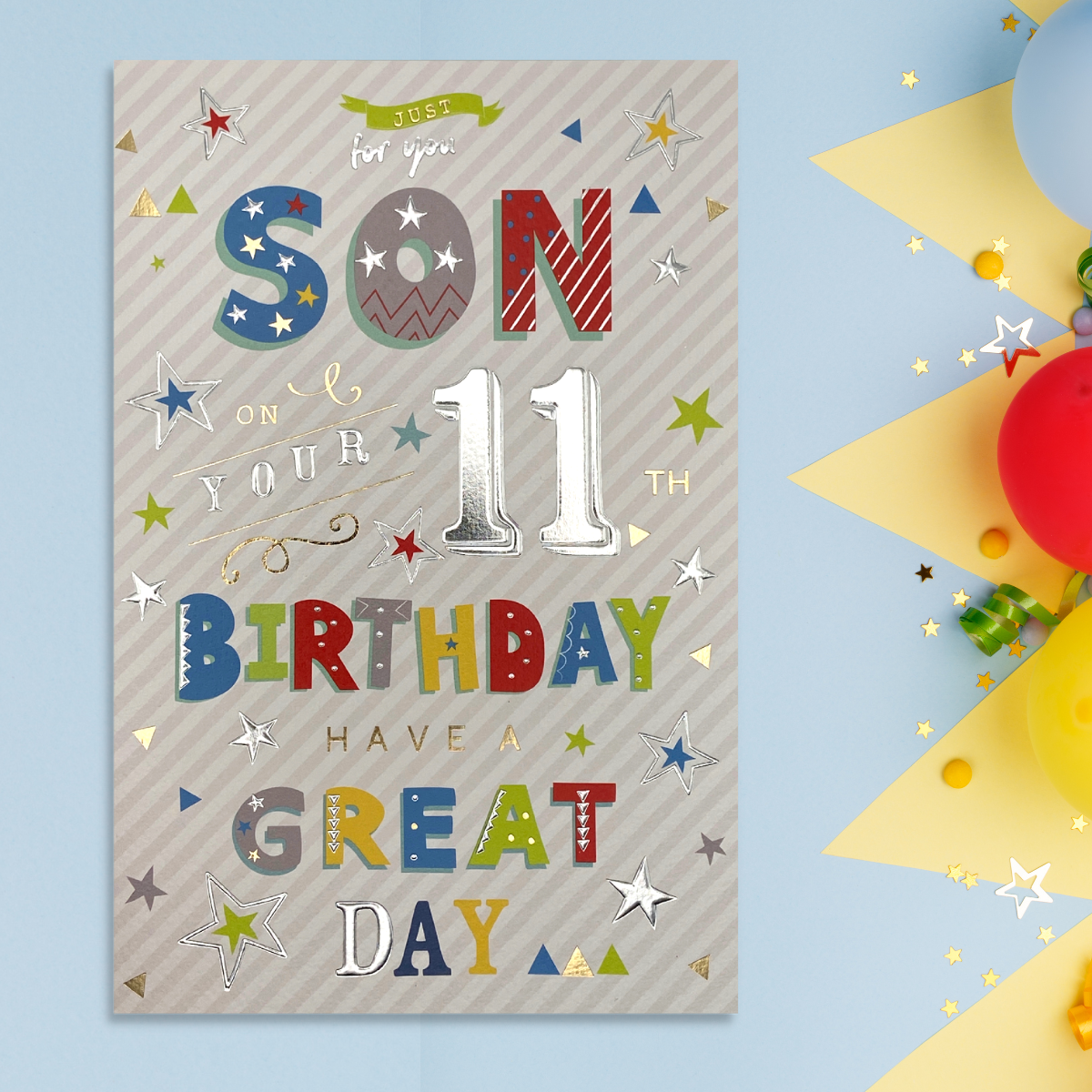 Front image showing brightly coloured text and silver foiled stars