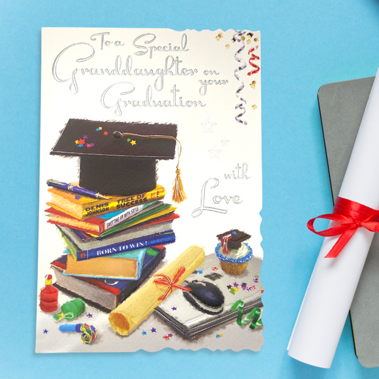 Front image showing stack of books, mortar board, certificate and silver foil text