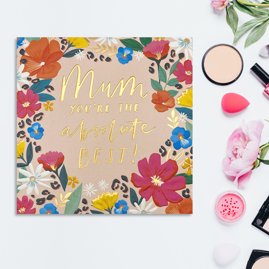 Vibrant flowers form a bold border on this square card with gold foil text