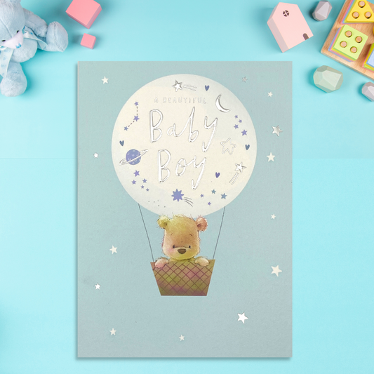 Nutmeg character in hot air balloon with blue theme and stars