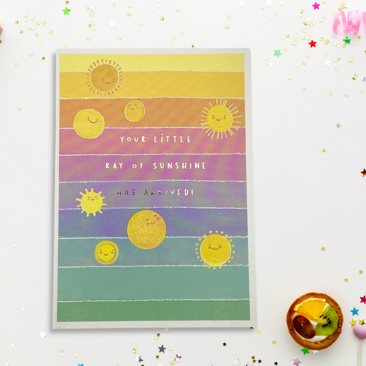 Rainbow coloured card with smiling sunchines and gold foil text
