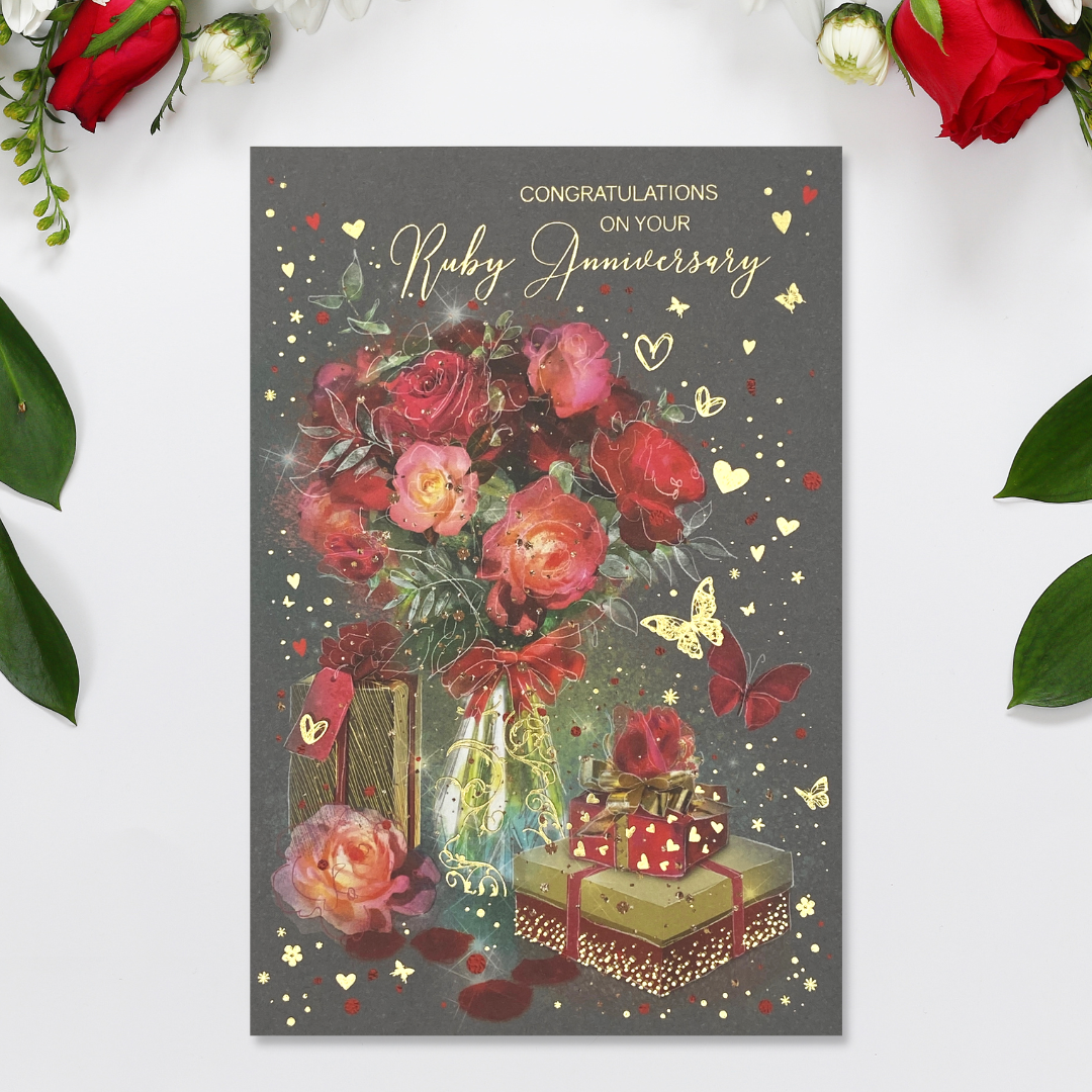 Grey card with vase of red roses with gifts and hearts