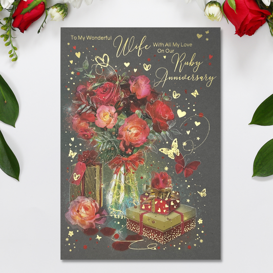 Grey card with red flowers in vase, with wrapped gifts and gold hearts