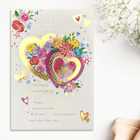 Front image with two hearts with multi colour flowers and text