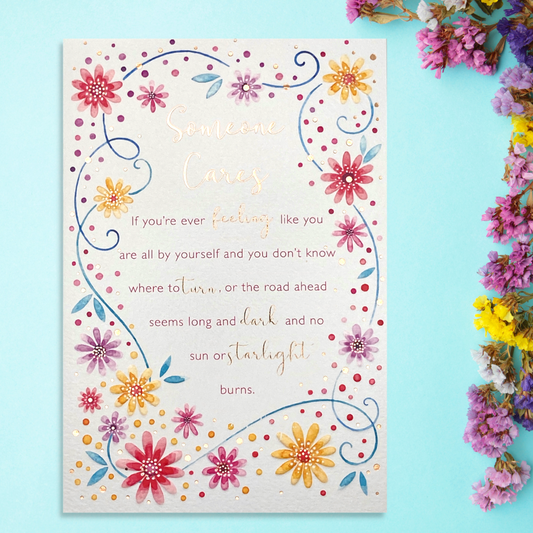 Front image showing floral border, watercolour dots and verse