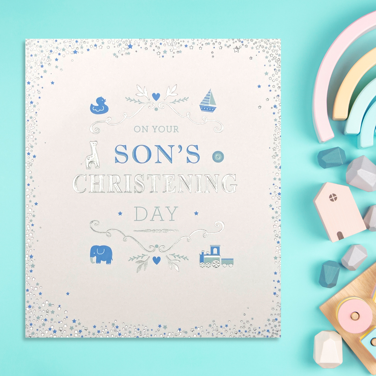 Front image with silver foil border and blue baby icons