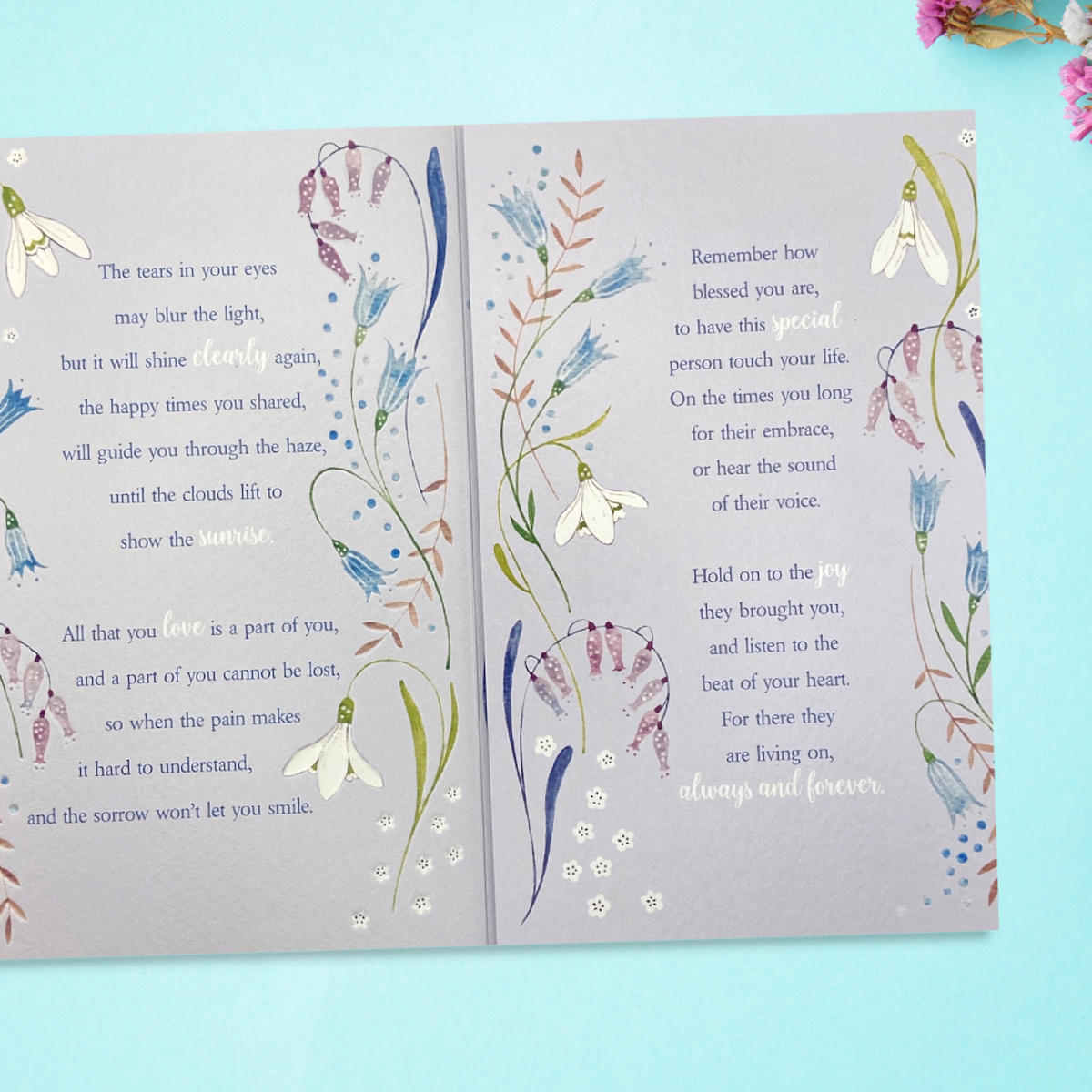 Inside with two pages of verse with floral borders