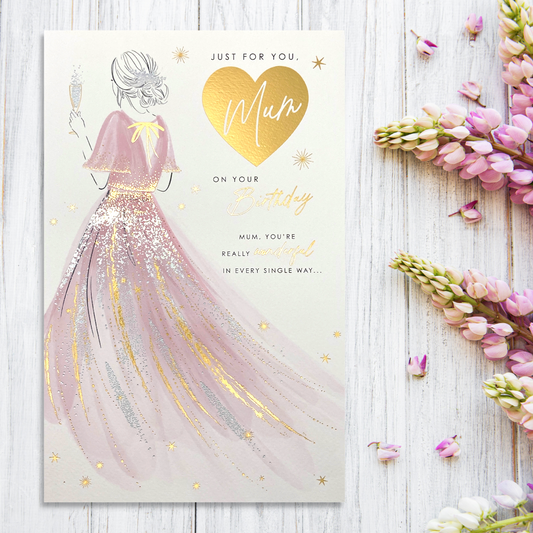 lady in pink dress with gold and silver details and gold foil heart