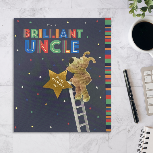 Square navy card with Boofle character up a ladder holding a gold star that says happy birthday