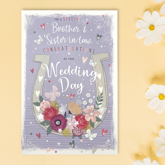 lilac theme card with horseshoe and floral decorations with hearts and butterflies
