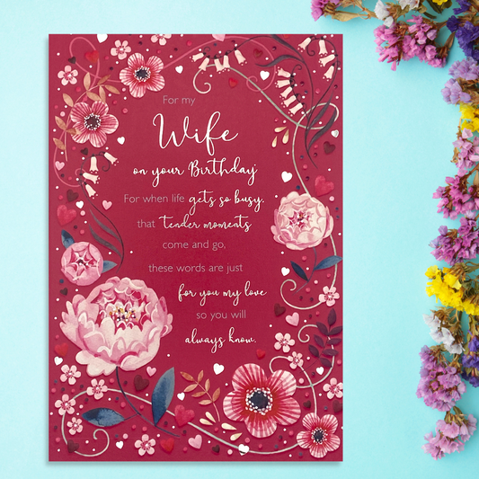 Red card with floral border and heartfelt verse