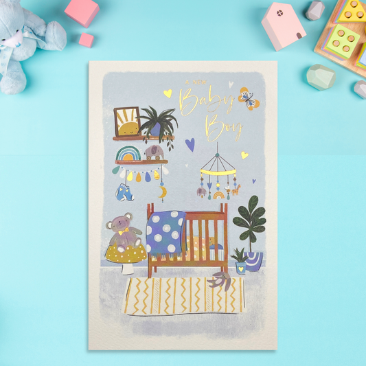 Blue and White nursery themed card with teddy and cot