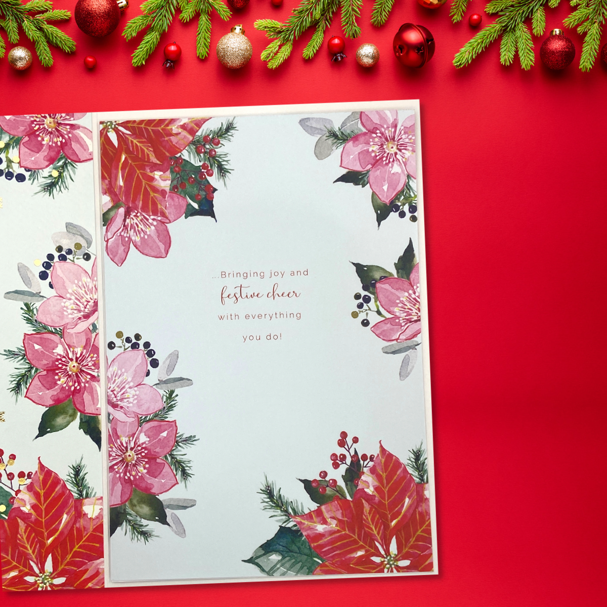 Inside image with large poinsettias and verse