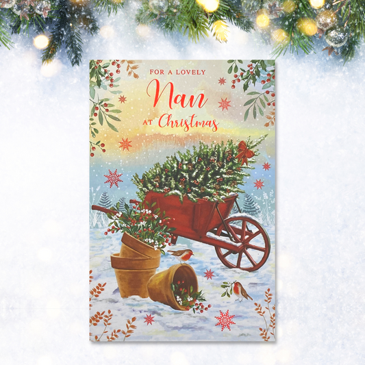 Front image with red wheelbarrow in snow carrying tree