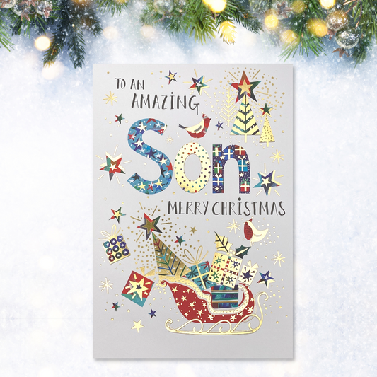 brightly coloured text and sleigh with gold foil details