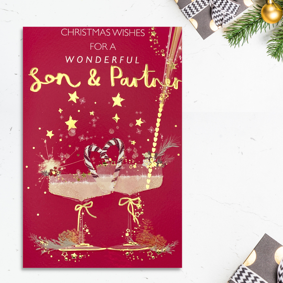 Front image red card with two martini glasses, stars and candy canes