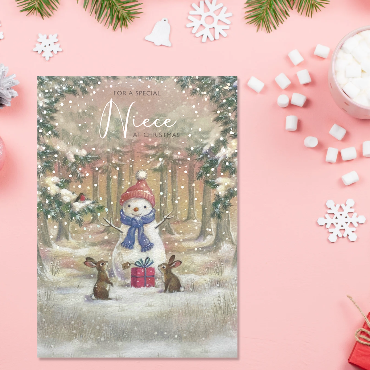 Cute illustrated snowman with bunnies in woodland