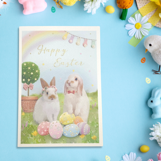 Easter card with two bunnies and eggs