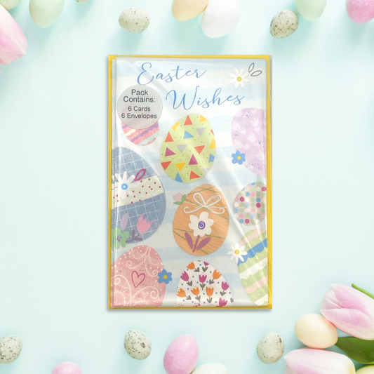 Image showing easter pack with multicolour patterned eggs and flowers with yellow envelopes