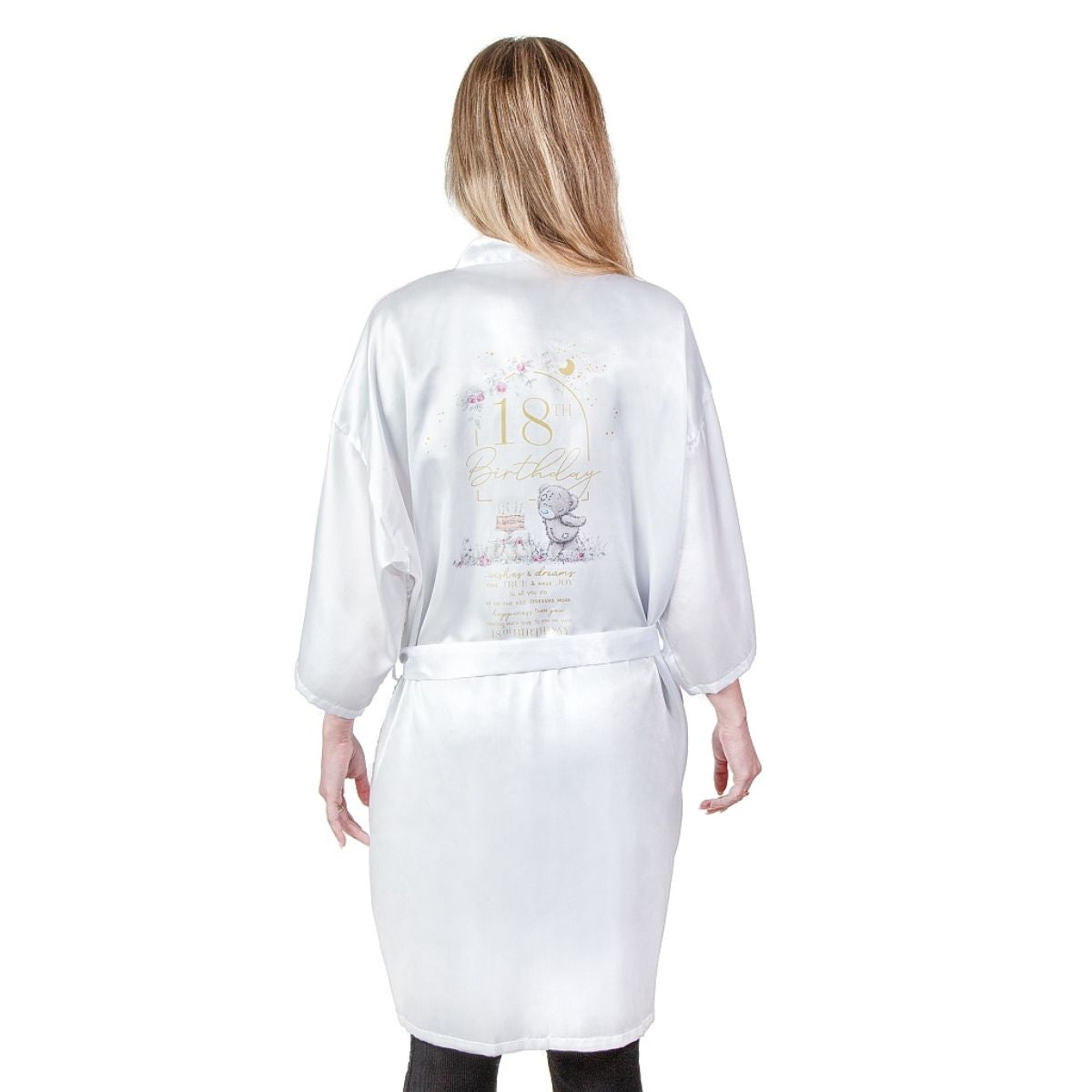 Me To You Signature Collection 18th Dressing gown shown from the back. Silky look white gown with long sleeves and belt. Large image printed on the back of Tatty Teddy blowing out the candles on a birthday cake.