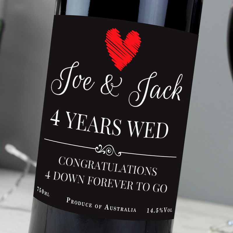 Wine bottle with a personalised label reading 'Joe & Jack 4 Years Wed' on a neutral background.