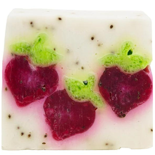 Berry Bar soap slice from Bomb Cosmetics with magnolia and rosewood essential oils. White with imitation strawberries inside. Glycerin soap and vegan friendly.