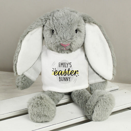Easter Bunny with Personalised T- Shirt! T-Shirt in white with Easter Egg image and Personalised name. Bunny in grey fur with white inside ears and pink nose.