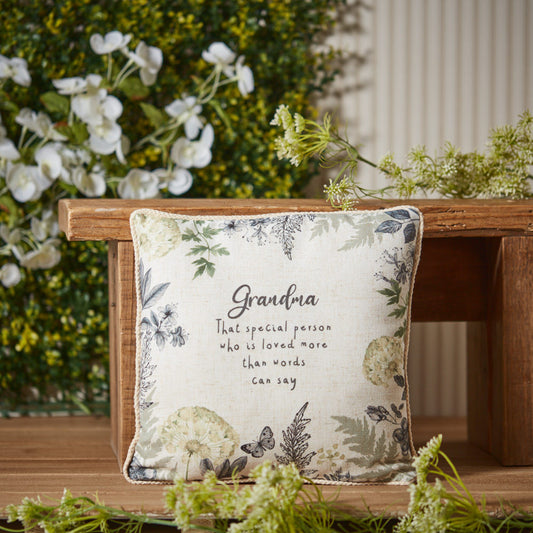Grandma Cushion Displayed With Flowers In The Background