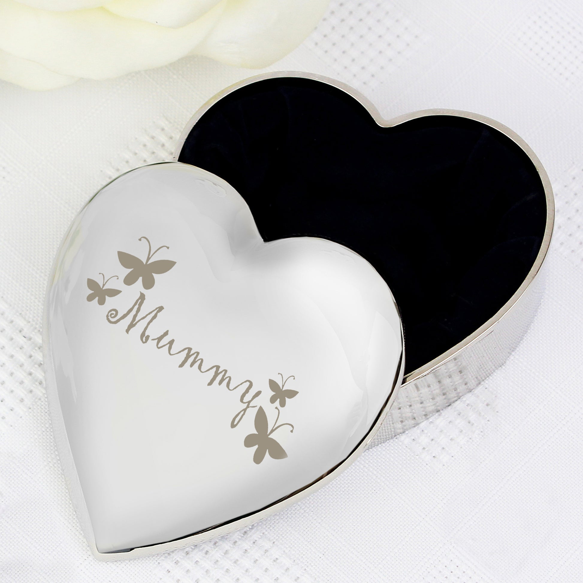 Heart-shaped silver trinket box with '18th Birthday' engraving on a white background