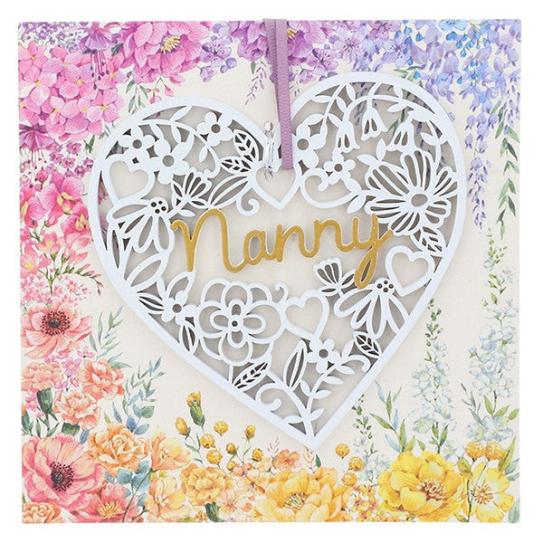 White lace effect wooden heart shaped hanging plaque with lilac ribbon and floral display card