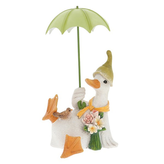 White Duck with yellow scarf, white and pink flowers, green hat and umbrella