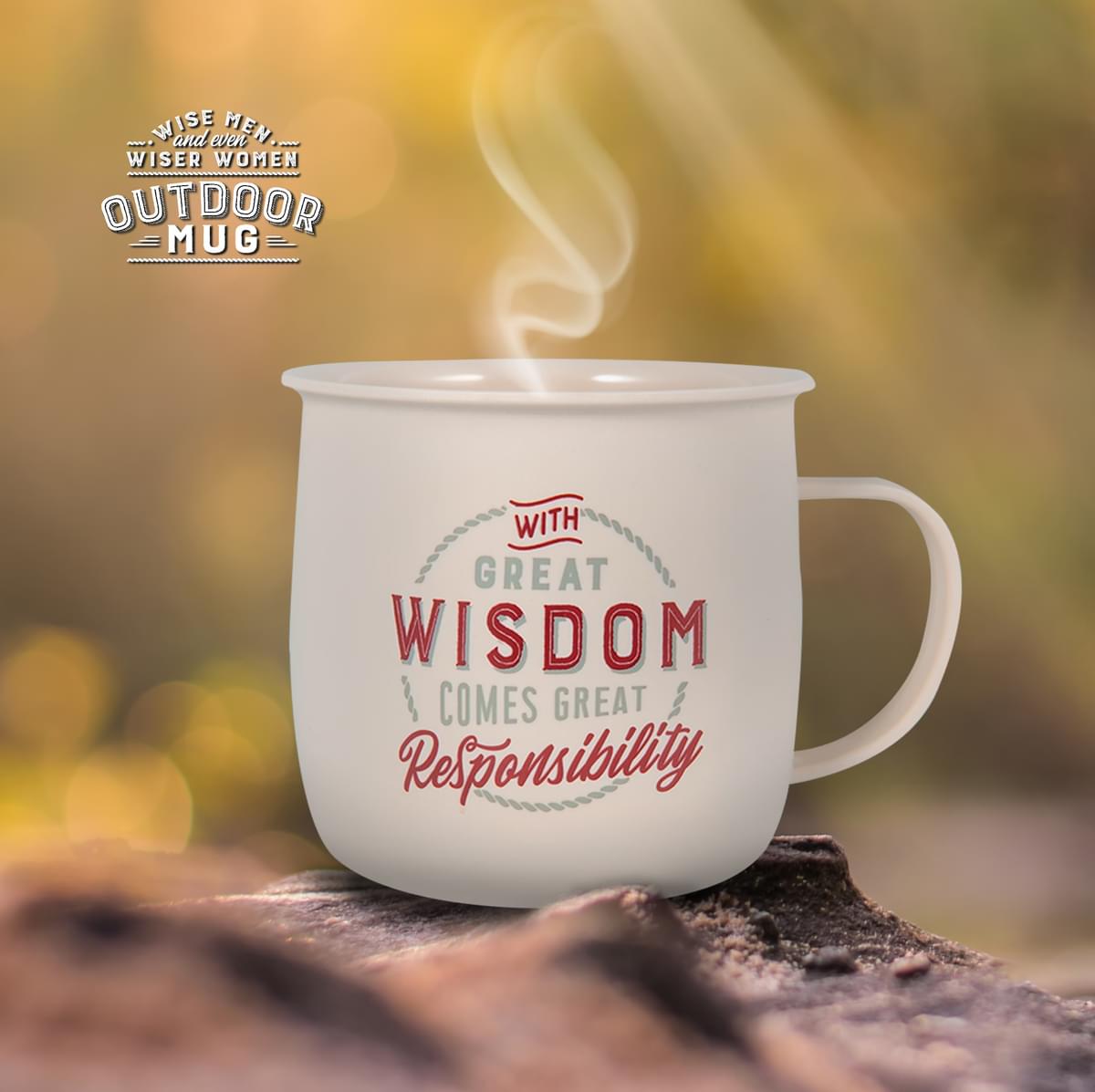 Outdoor Mug shown in the outdoors on the ground with steam rising from the mug.