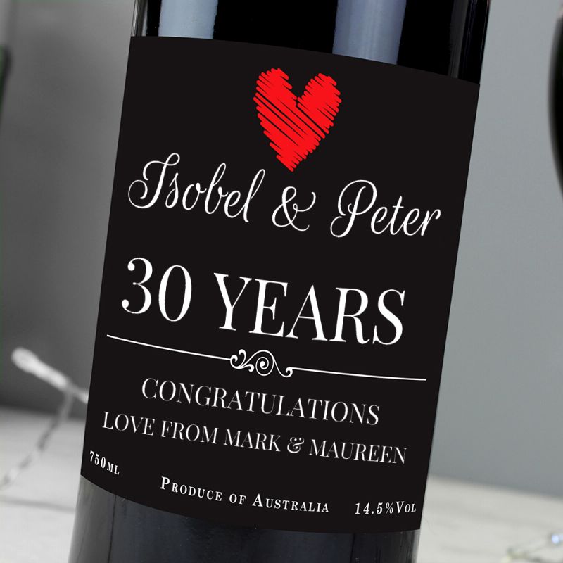 Wine bottle with a personalised label for 30th anniversary, featuring a red heart.