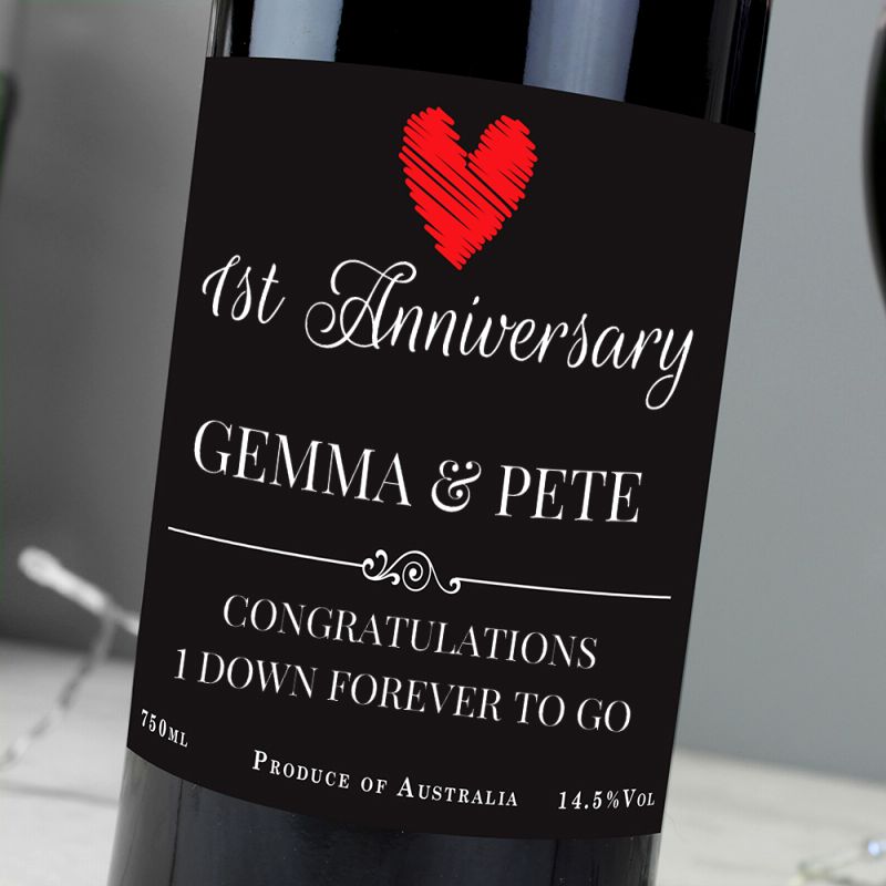 Wine bottle with a personalised label for 1st Anniversary, featuring a red heart and text.