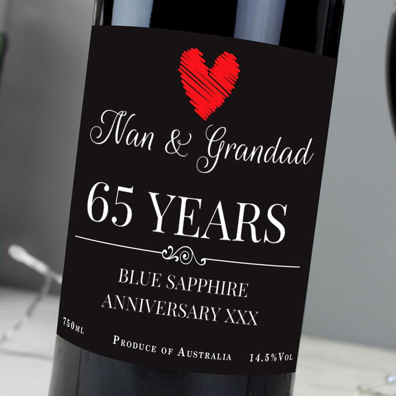 Wine bottle with a personalised label for Nan & Grandad celebrating 65 years.