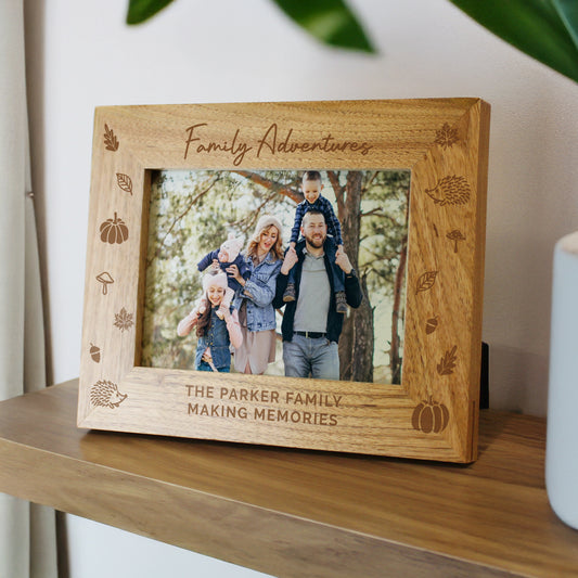 Personalised Autumn themed wooden photo frame with family photo and engraved text on a shelf.