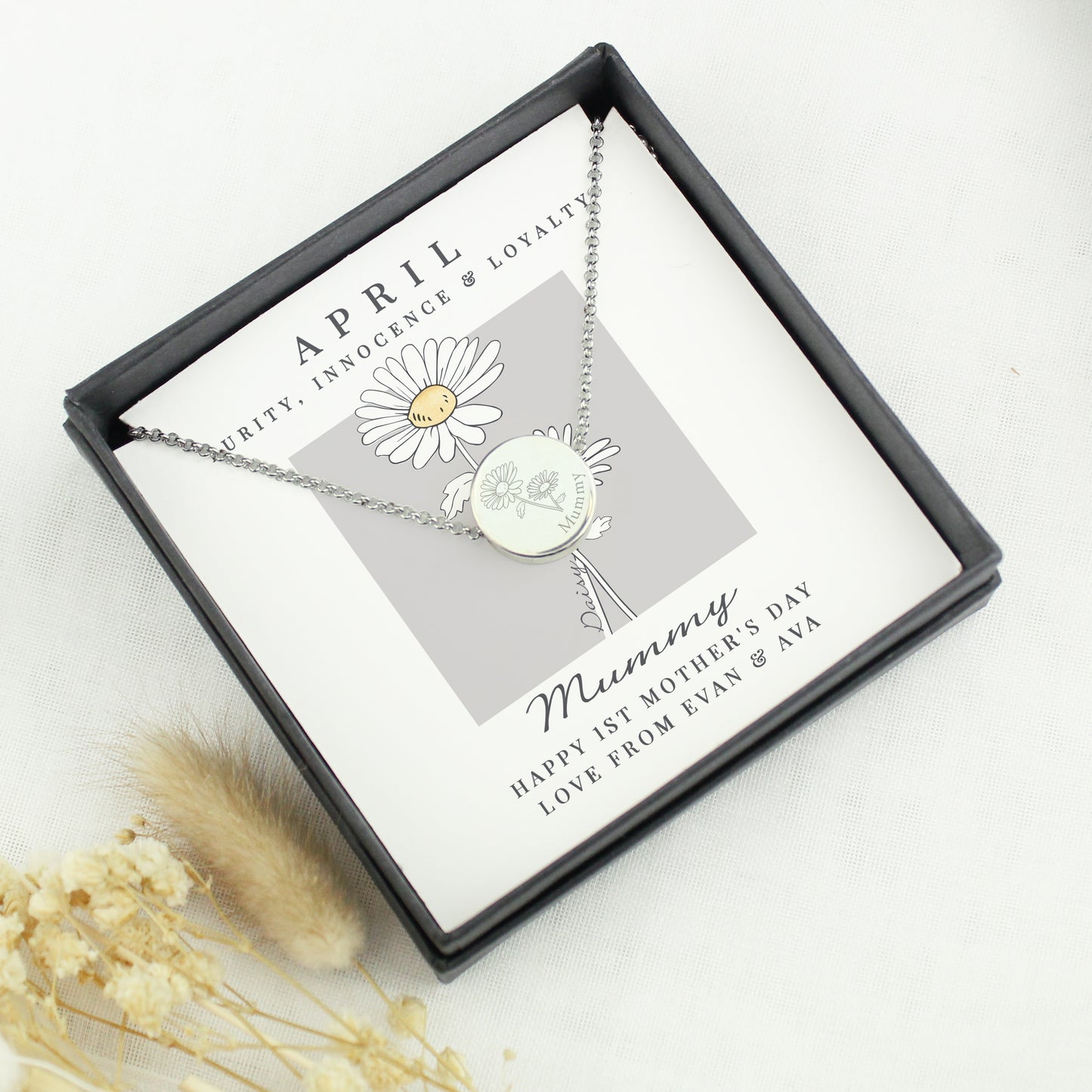 Necklace with a daisy pendant in a gift box with text