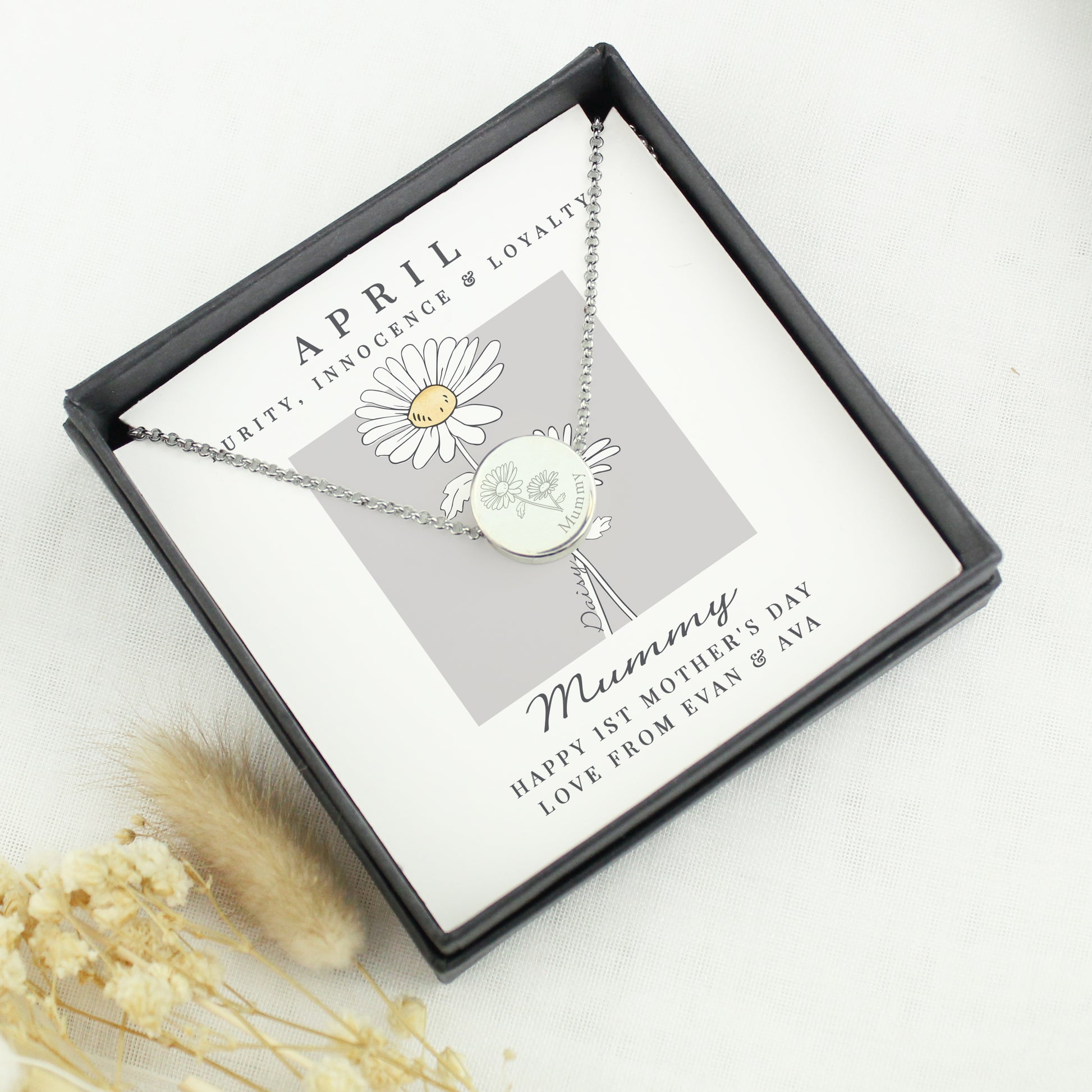 Necklace with a daisy pendant in a gift box with text