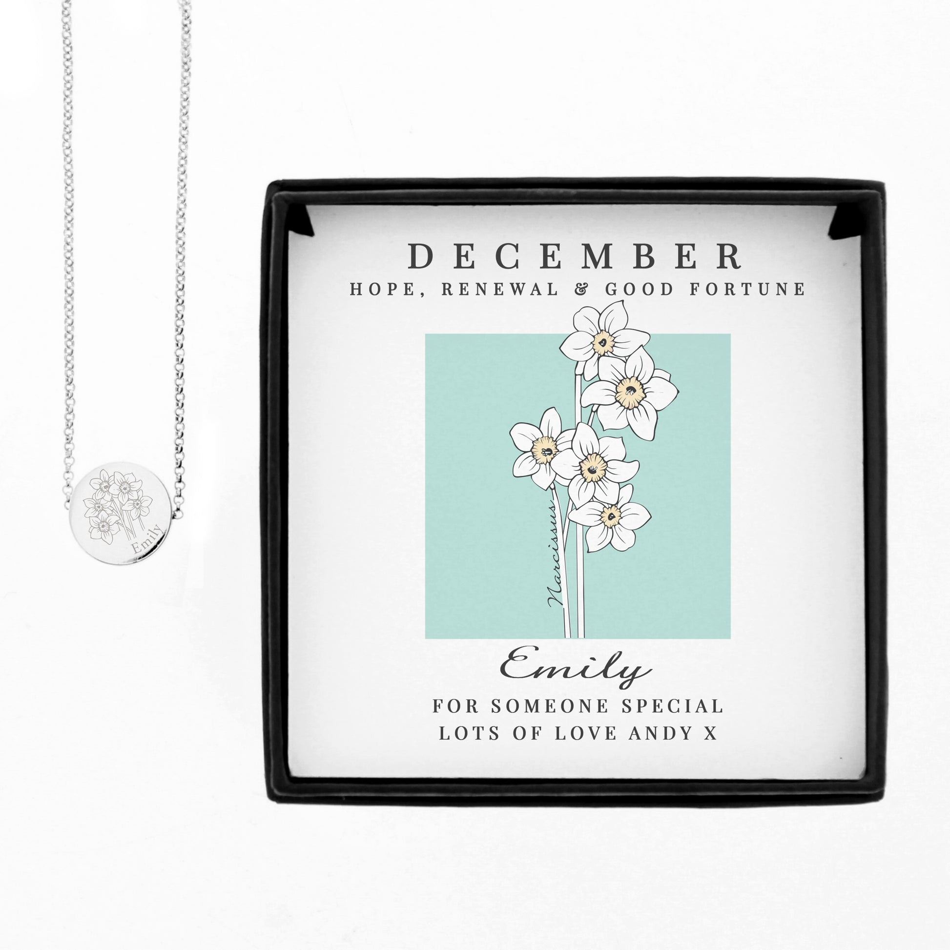 Necklace in a decorative box with floral design and text