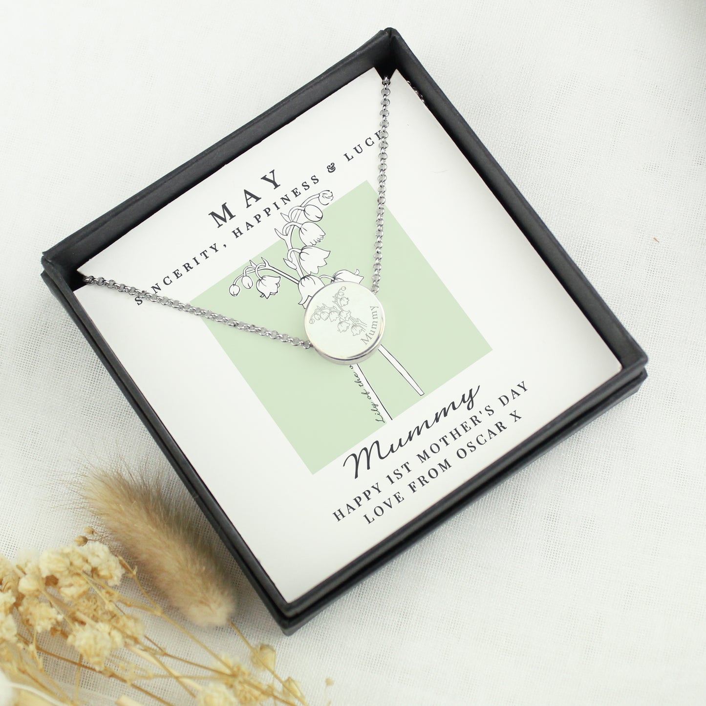 Necklace in a gift box with a personalised message on a light background