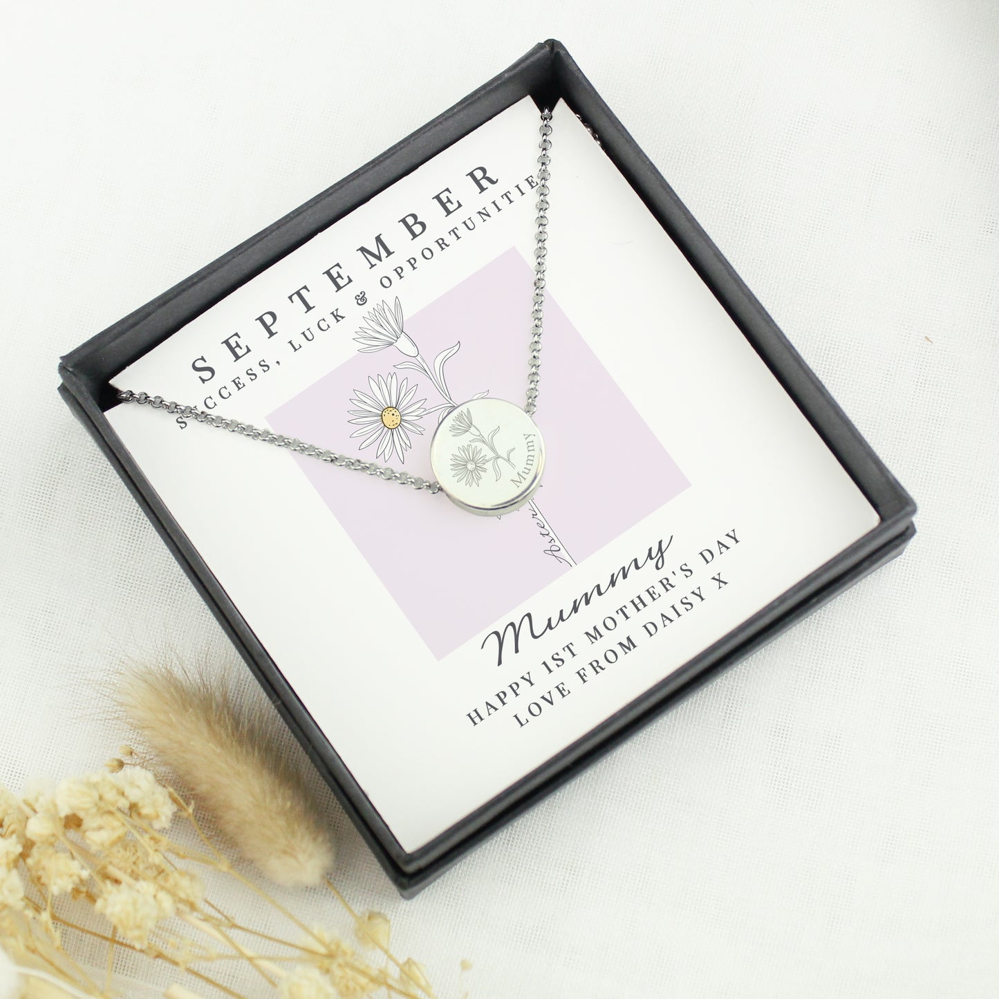 Necklace in a gift box with 'September' and 'Mummy' text on a white background