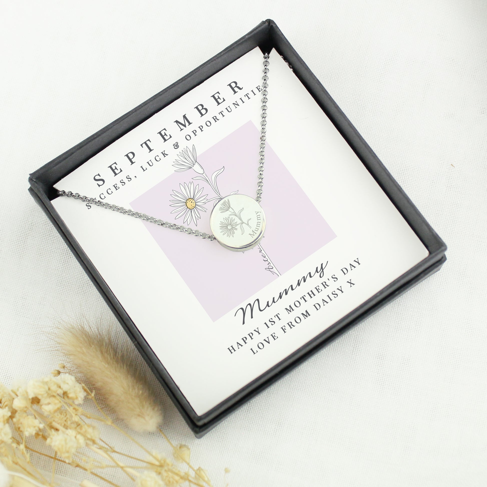 Necklace in a gift box with 'September' and 'Mummy' text on a white background