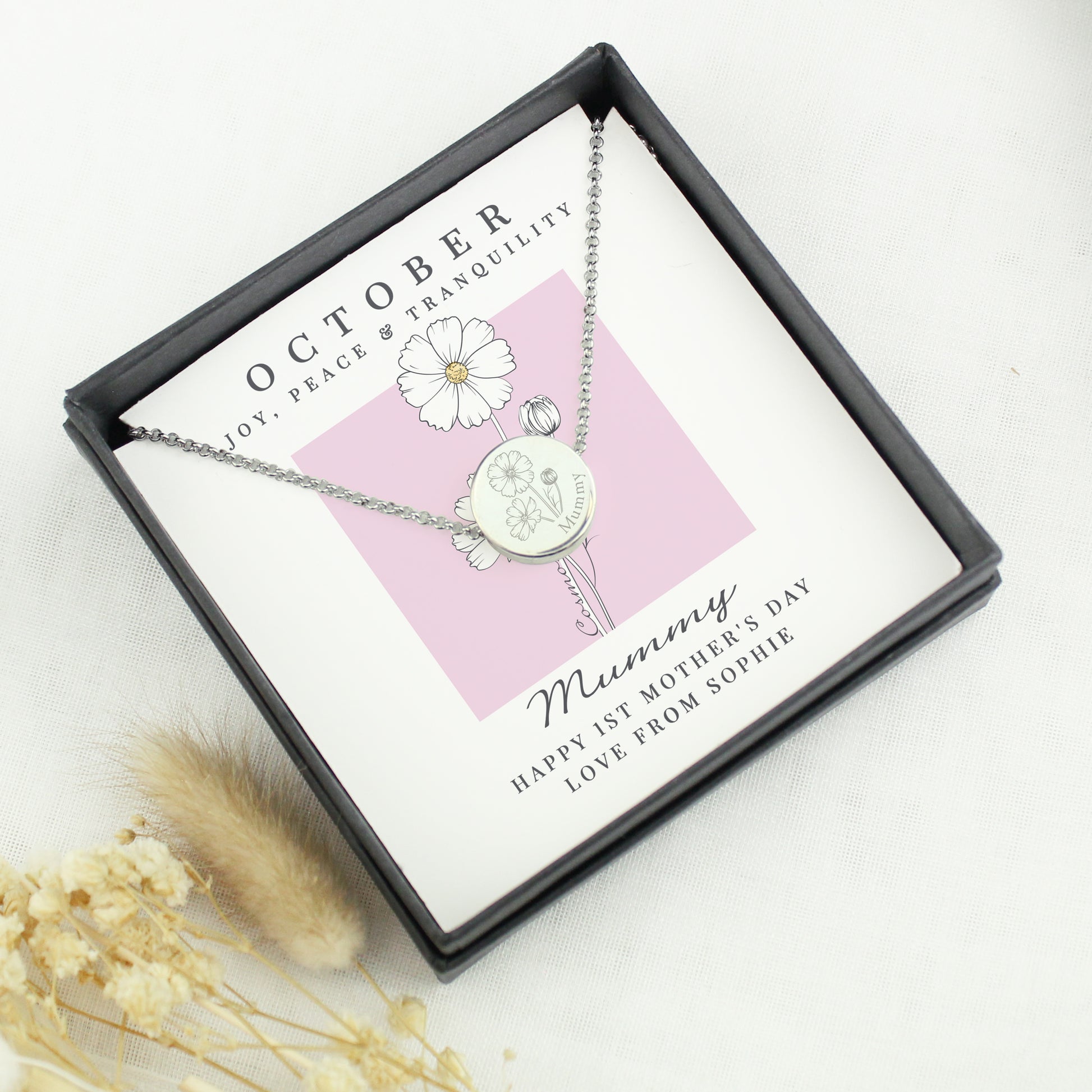 Necklace with a pendant in a gift box with a card, on a light background