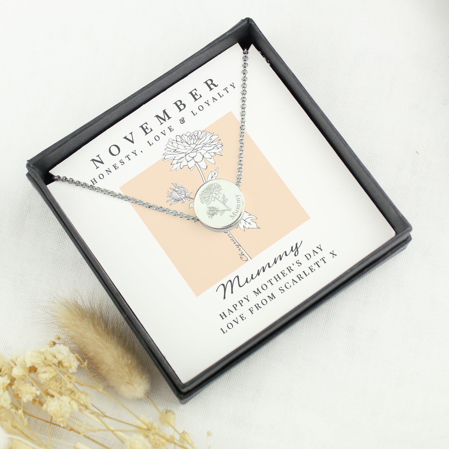 Necklace in a gift box with a personalised message on a white background