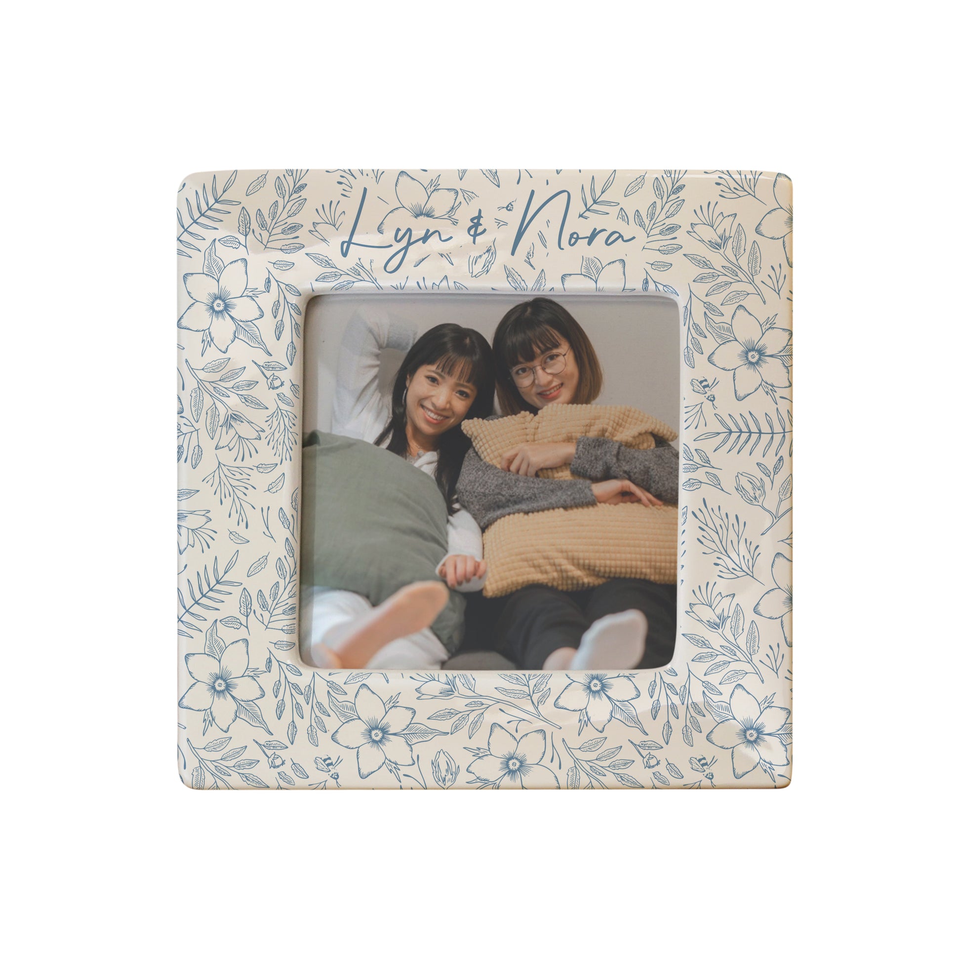 Floral photo frame with two people inside, on a white background