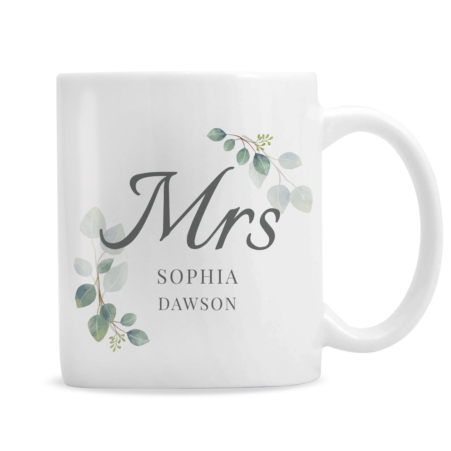 White mug with 'Mrs' and decorative leaves on a white background