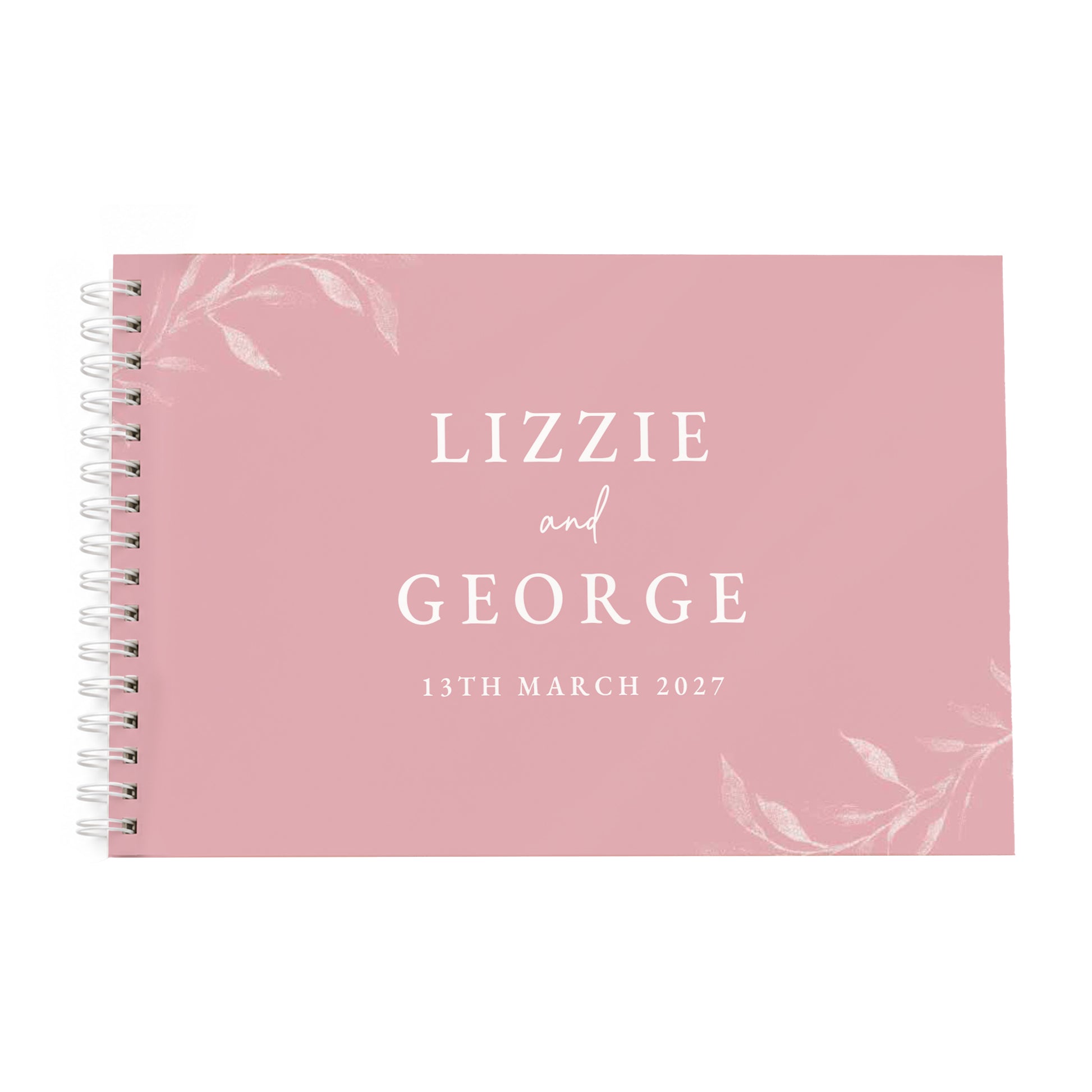 A pink spiral-bound guest book with white text reading 'LIZZIE and GEORGE 13TH MARCH 2027' and delicate white floral illustrations in the corners, shown on a plain white background.