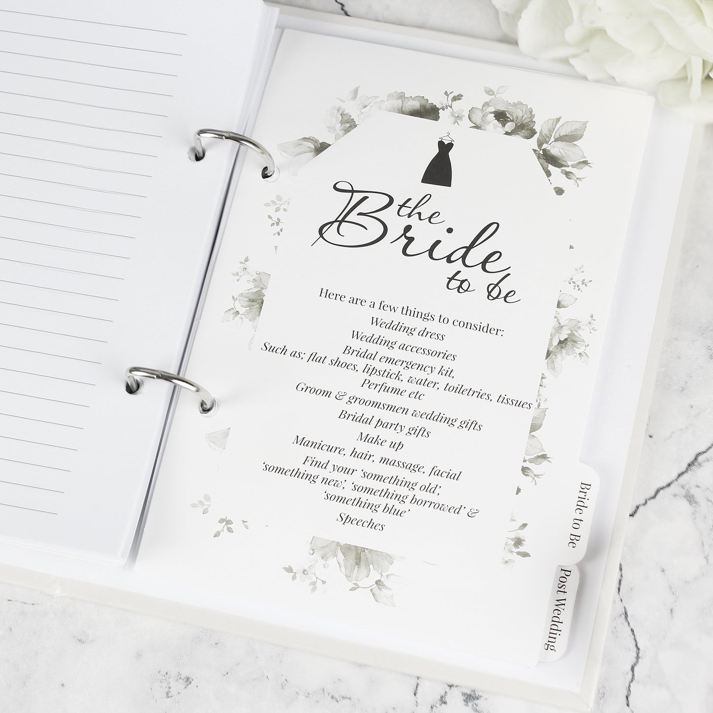 Card for 'Bride to Be' with wedding checklist on a marble surface