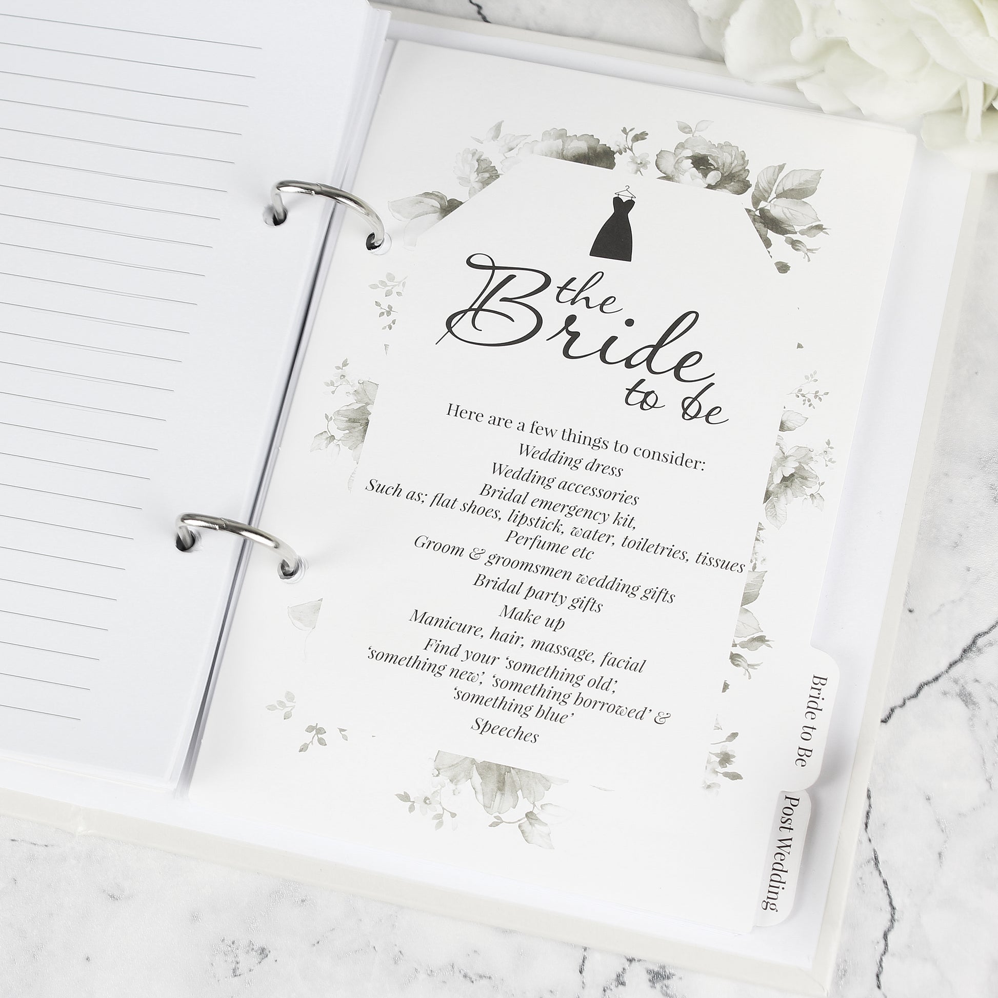 Card for 'Bride to Be' with wedding checklist on a marble surface